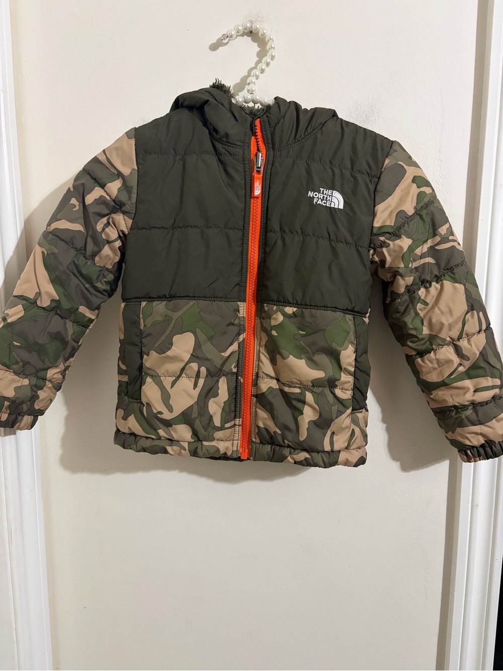 The North Face Kids Reversible Camo Puffer Jacket with Orange Zip
